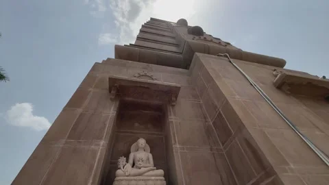 Crane up of stone statue of buddha at sarnath temple, Sarnath is a significant Stock Footage 312930609