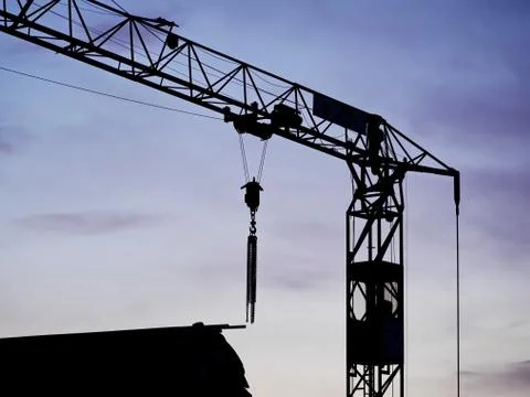 Crane sunset building site Stock Photos