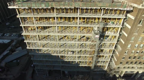 Crane on top a building under construction Stock Footage 64144736