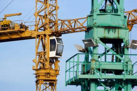 Crane tower on sky background at construction site Stock Photos