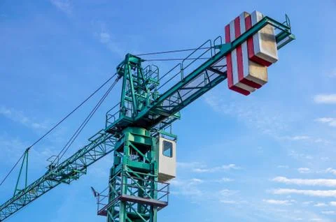 Crane tower on sky background at construction site Stock Photos