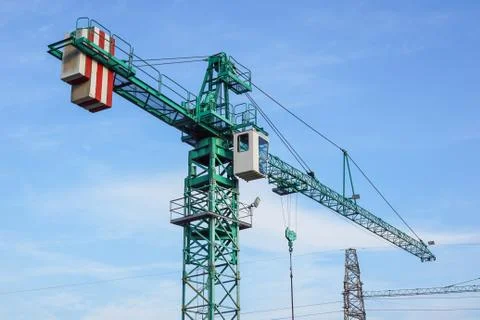 Crane tower on sky background at construction site Stock Photos