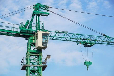Crane tower on sky background at construction site Stock Photos