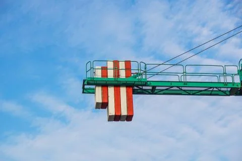 Crane tower on sky background at construction site Stock Photos