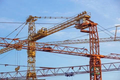 Crane tower on sky background at construction site Stock Photos