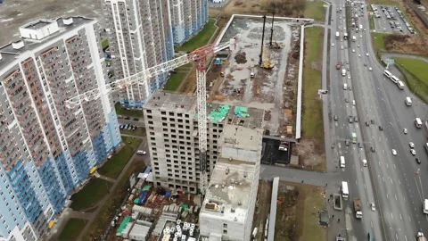 Crane trolley is moving. Crane tower turns and moves. Big crane building in the Stock Footage 131891726