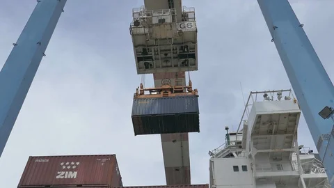 Crane unloading container from ship to terminal 4k Stock Footage 108986146