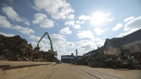 Crane unloads scrap metal Stock Footage 72715447
