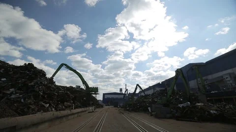 The crane unloads scrap metal Stock Footage 72715562