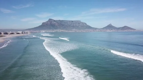 A crane view of Table Mountain from Milnerton beach in 4k. Stock Footage