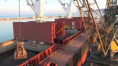 A crane at work at seaport Stock Footage 85559478