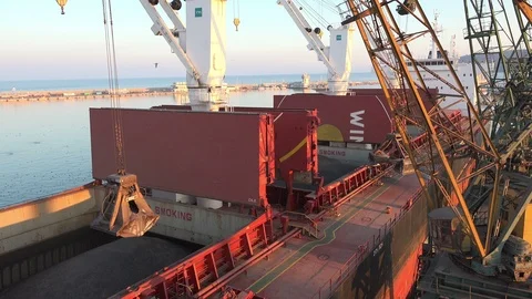 A crane at work at seaport Stockbeeldmateriaal 85560565