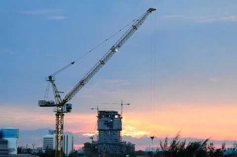 A Crane at Work at Sunset Stock Photos