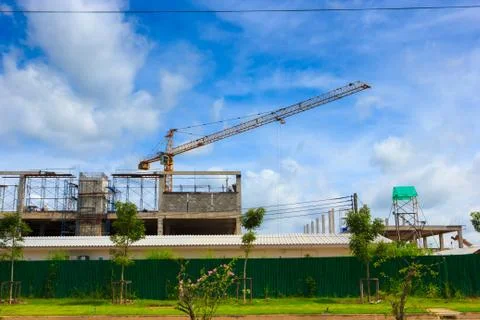 Crane working in construction on blue sky Stock Photos