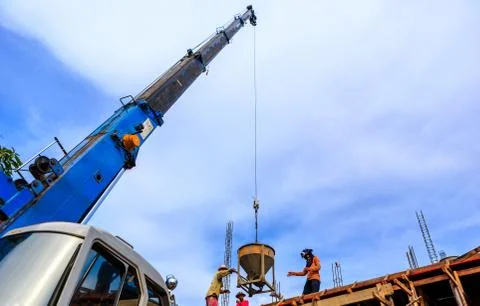 Crane working in construction on blue sky Stock Photos