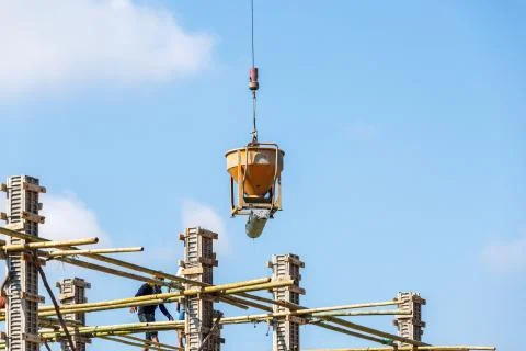 Crane working in construction on blue sky Stock Photos