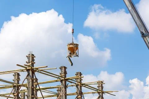 Crane working in construction on blue sky Stock Photos