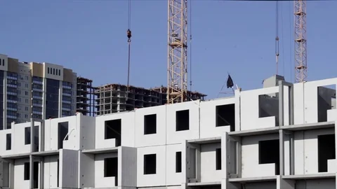 Crane working at construction of high building Stock Footage 75240871