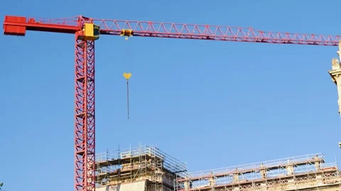 A crane working at a construction site in the city Stock Footage 283630779