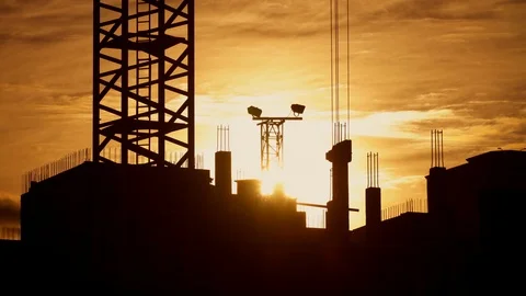 Crane working on construction site elevate concrete mixer, workers on building Stock Footage 105403331