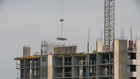 Crane working on construction site elevate steel structures residential building Vidéo 114829572