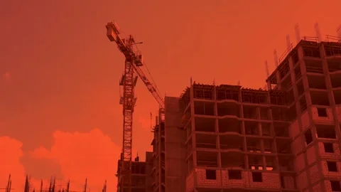 Crane is working at construction site with incomplete building Stock Footage 198337323
