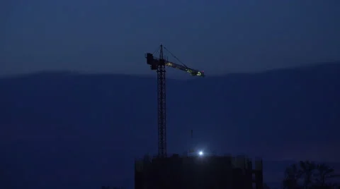 Crane Working in Construction Site at NIght Free Stock Footage 49626167