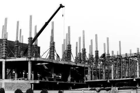 Crane working in construction site Stock Photos