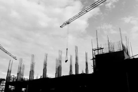 Crane working in construction site Stock Photos