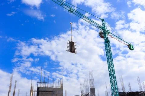 Crane working in construction site Stock Photos