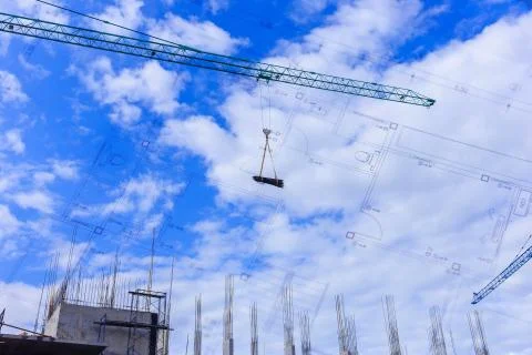 Crane working in construction site Stock Photos