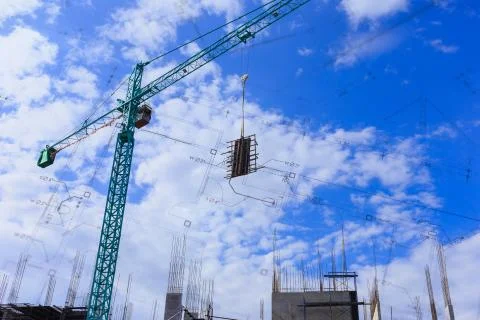 Crane working in construction site Stock Photos
