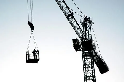 Crane working at Construction site Stock Photos