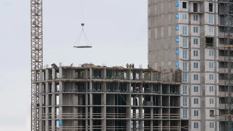 Crane working construction site residential housing estate constructors working Vídeos de archivo 103465442