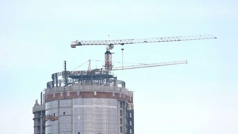 Crane Working in Construction Site at Winter. 4K Ultra HD Stock Footage 83793817