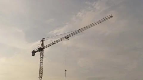 Crane Working At Sunset Stockbeeldmateriaal 84086309