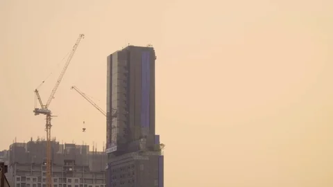 Crane working on top building construction Stock Footage 108569768