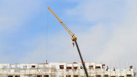 Crane working on tower in construct site and blue sky Stock Footage 98247831