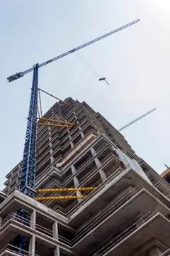Crane works on the construction Stock Photos