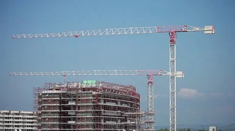Cranes in action in a construction site - timelapse Stock Footage 8561459
