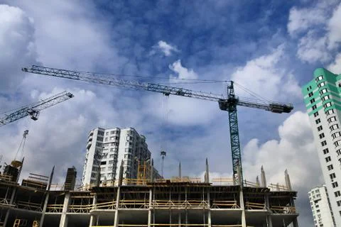 Cranes and construction of microdistrict Stock Photos
