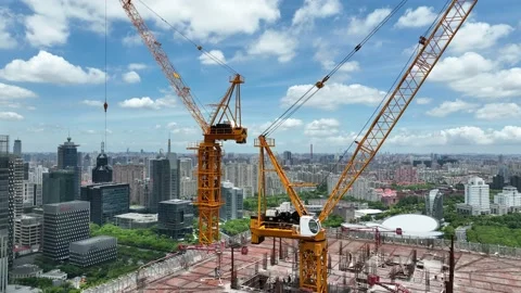 Cranes and construction site in the city. Drone aerial view Stock Footage 221014839