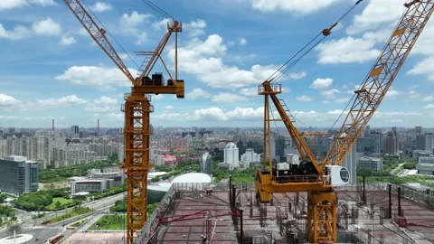 Cranes and construction site in the city. Drone aerial view Stock Footage 221014879
