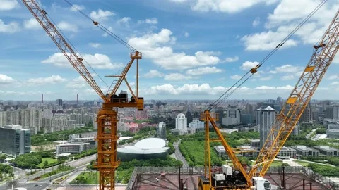 Cranes and construction site in the city. Drone aerial view Stock Footage 221014901