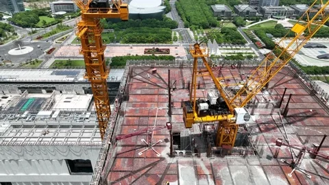 Cranes and construction site in the city. Drone aerial view Stock Footage 221015033