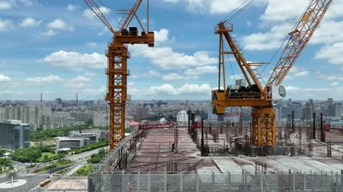 Cranes and construction site in the city. Drone aerial view Stock Footage 221015034