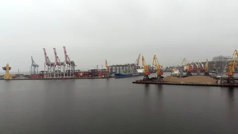Cranes and containers at the seaport Видео 105672843