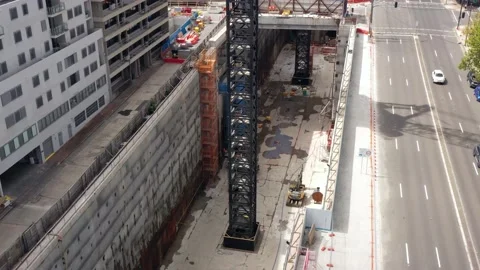 Cranes and metro tunnels in construction pit of Crows Nest metro station in 4k. Stock Footage 148980295