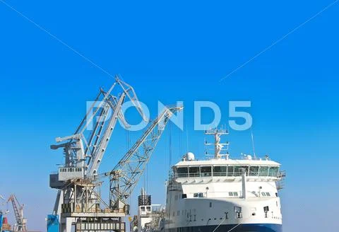 Cranes and ship under construction at the shipyard Stock Photos
