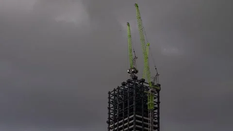 Cranes are constructing a tall building in the center of Ulaanbaatar, Mongolia. Stock Footage 338389073